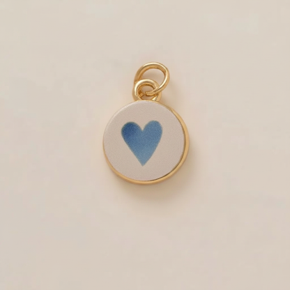 Blue heart round charm - cream background
