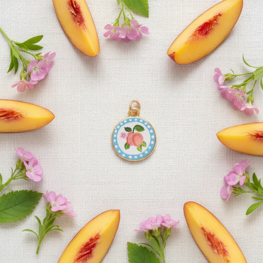Double peach round charm - linen flat lay