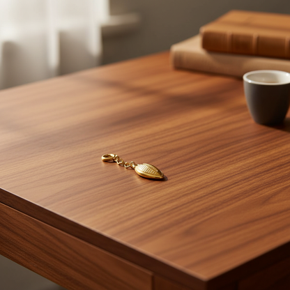 Gold Cowrie Charm - Walnut Desk