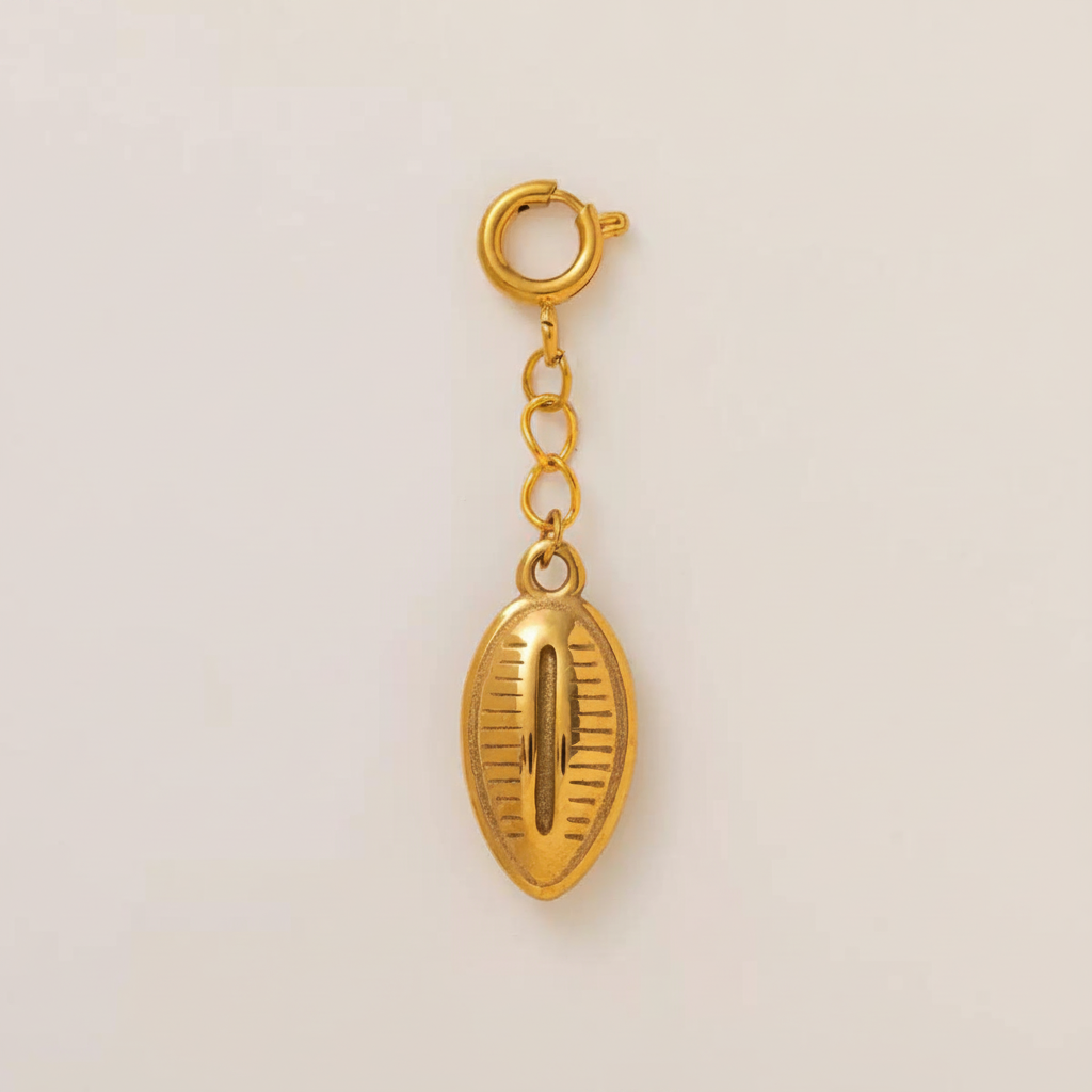 Gold Cowrie Shell Charm - Flat Lay