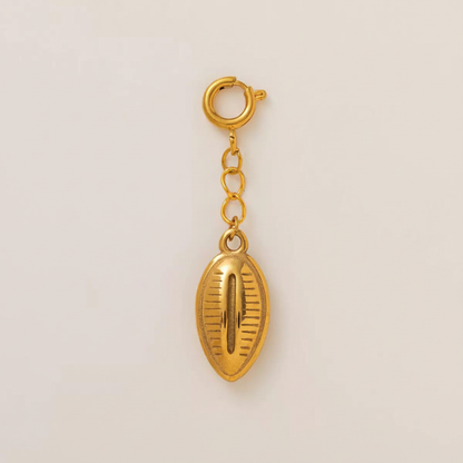 Gold Cowrie Shell Charm - Flat Lay