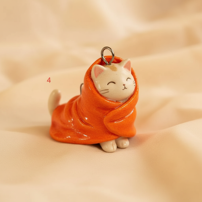 Orange scarf white cat ceramic charm 3/4 view