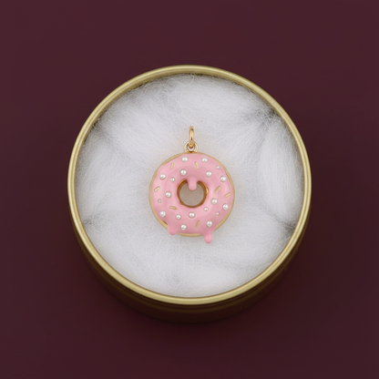 Pink donut charm in gold tin box