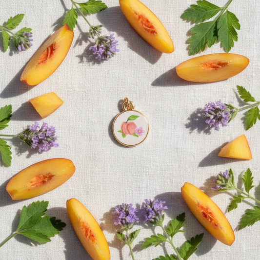 Peach enamel charm - linen flat lay
