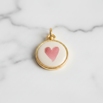 Pink heart round charm - marble close-up