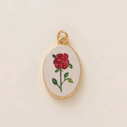 Single red rose oval charm - cream background