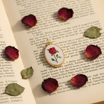 Single red rose oval charm - vintage book
