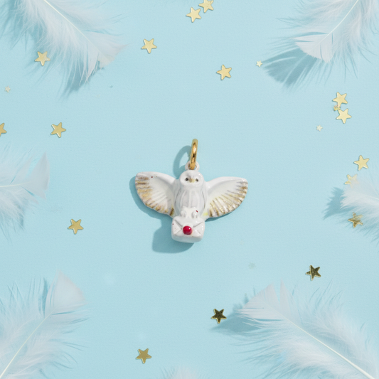 White Dove Charm - Blue Feather Flatlay